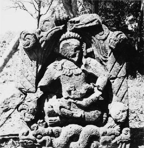 Sculptured figure seated cross-legged (maize god?)