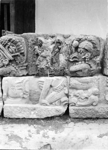 Sculptured stones with seated figures