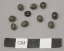 Beads, 9 black seeds and 1 black glass bead
