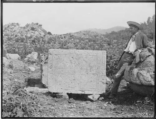 Man next to sculpture Y