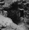 Stone lined cist under bench at south end of east room