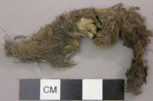 Hide fragment with fur, twisted into a strand