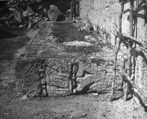 Reused sculptured stones on east side of dais. Location 9.