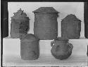 Five complete pottery vessels from Tomb 11 on display