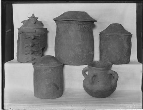 Five complete pottery vessels from Tomb 11 on display