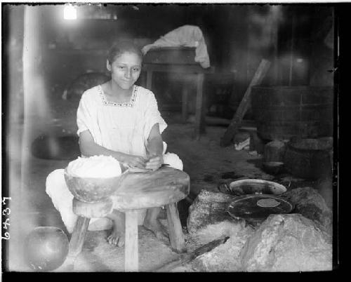 Anita grinding corn