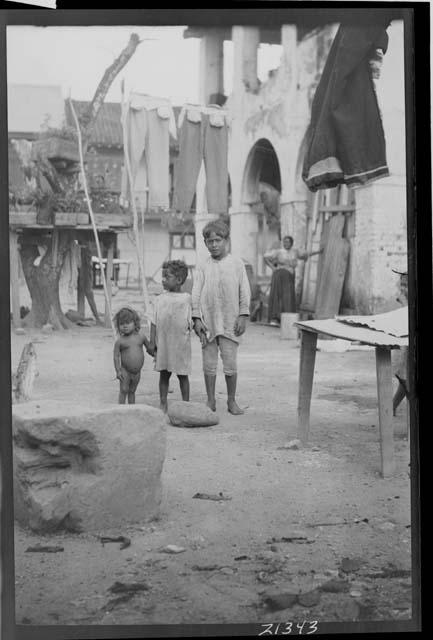 Children in front of building