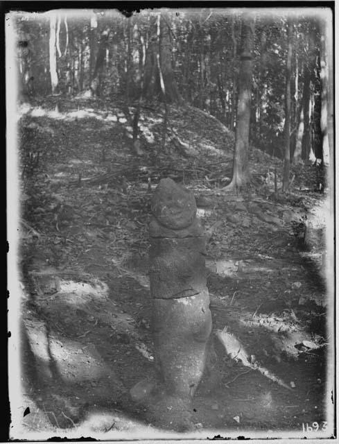 Idol, mound and terrace at ruins east of Uloa River, front view