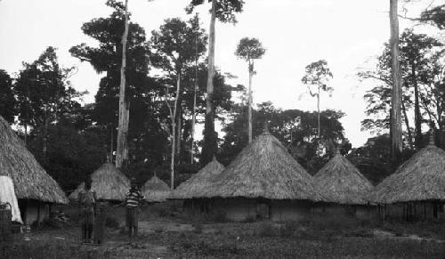 Men at deserted town on the tie-kunebo route