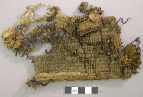 Textile fragment, woven dark brown and black, possibly  wool