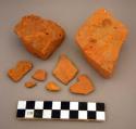 Brick, architectural, ceramic, orange fragments of various sizes