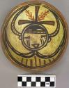 Bowl, polacca polychrome style c. int: kachina design; ext: slipped, no design.