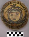 Bowl, polacca polychrome style c. int: clown design; ext: slipped, no design. 5.