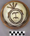 Bowl, polacca polychrome style c. int: clown design; ext: slipped, no design. 6.