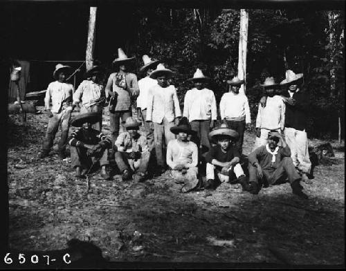 Group of men on riverbank