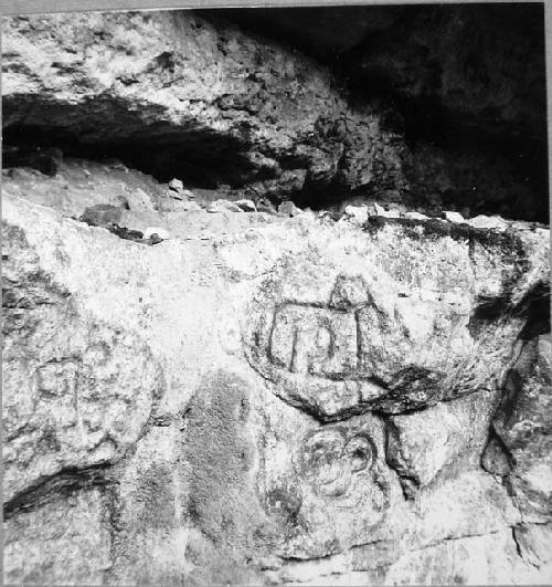 Rock carving on East wall of cenote. South end