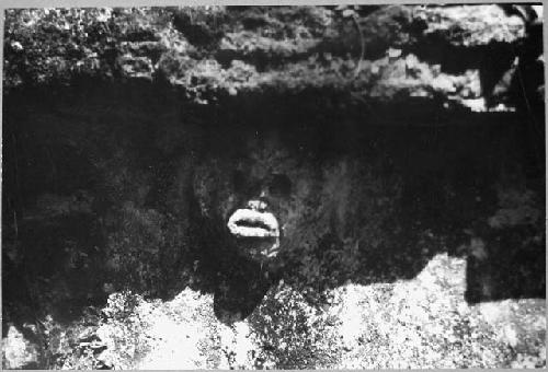 Structure 5. East facade. Stucco mask under molding.