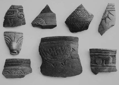 Brown-black coarse-incised sherds (8)