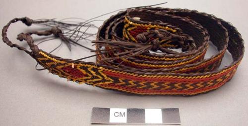 Basketry belt - brown with red and yellow designs