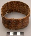 Woven arm ring and bunch of fiber worn under same