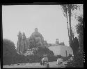 Men in front of church in rural setting