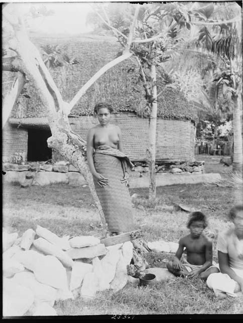 Woman in front of Hut