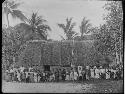 Native People in front of Hut