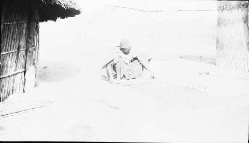 Woman making mat