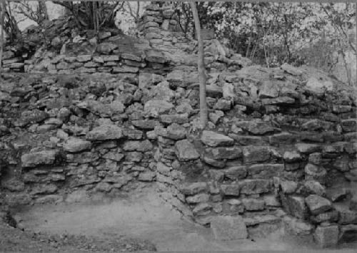 Stairway shrine and stone female idol at Structure Q214