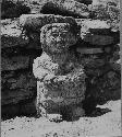 Stone female idol in shrine room of stairway at Structure Q214