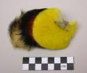 Feather pendant worn by baby - hangs down back