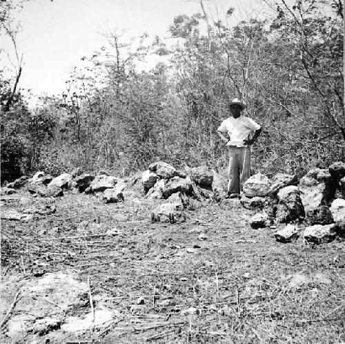 Man standing on old modern wall, much fallen, Section AA, S500, W530