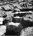 Str. Q-59  from W. showing E-W trench exposing several plaza floors