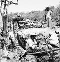 Men excavating bench and wall, Structure Q-97; North end