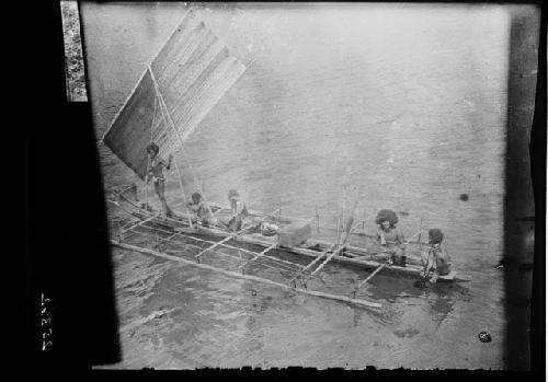 Outrigger canoe with sail