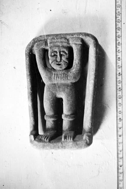 Limestone Atlantean figure in frame