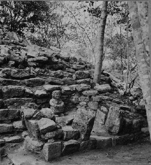 Stairway shrine and stone female idol at Structure Q214