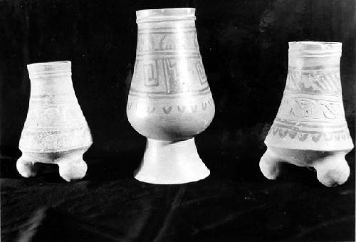 3  X  Fine Orange vases  a: Pyriform tripod vase, gouged-and-incised, plus black