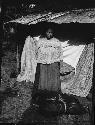 Woman in front of tent