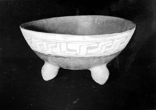 Fine Orange tripod bowl, gouged-and-incised (but approaching plano-relief carvin