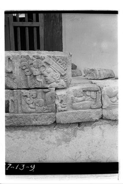 Hieroglyphic frieze stones with seated figure from top of Mound 26