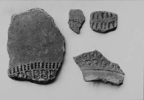 Four stamped potsherds