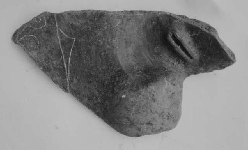 Fragments of: large swollen-cheek, brown-black fine incised, face semi-effigy ja