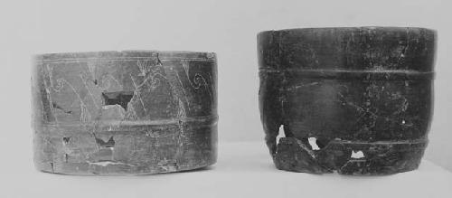 Black-brown fine incised and unincised cylinders (2)