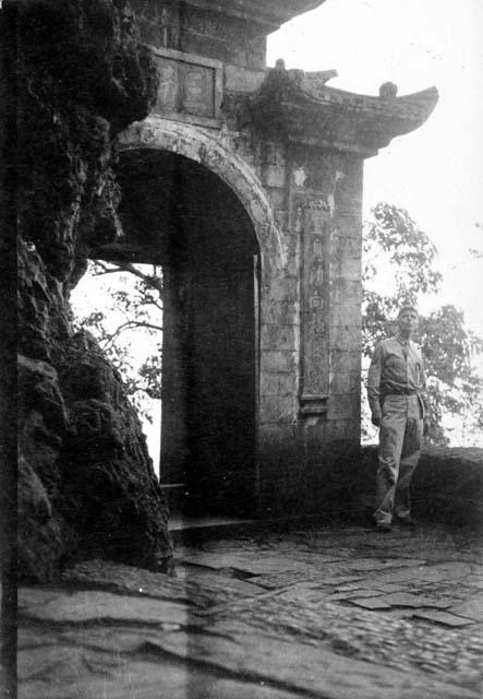 Man standing in front of archway