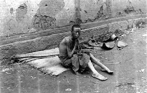 Boy sitting on blanket