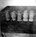 Small fine orange vases with pedestal base, from mound 53-21-81