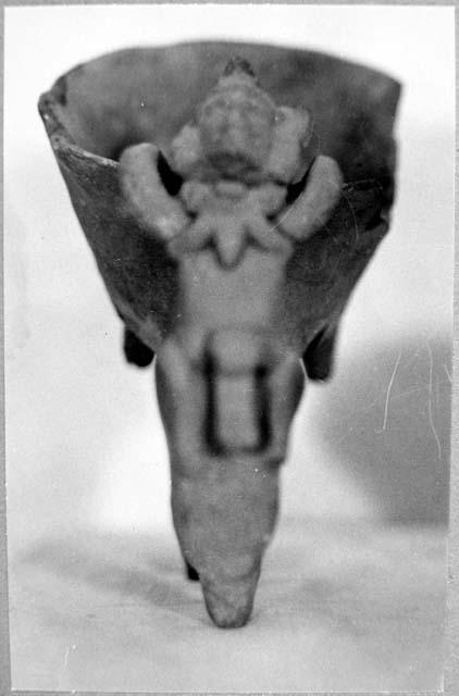 A. Anthropomorphic jar - side view showing legs & lug.  B. Tripod incensario? fr