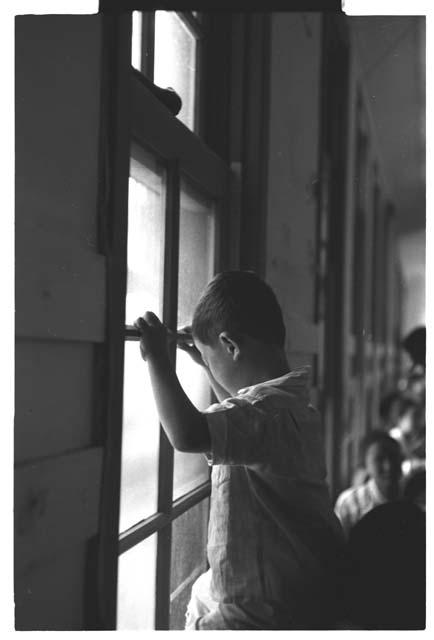 Little boy near window