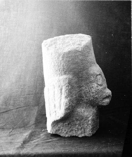 Fragment of mushroom stone with bird carved on stem